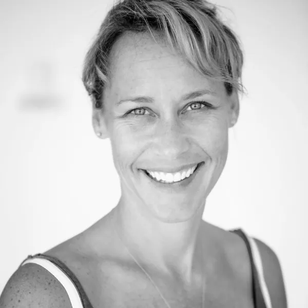 Black and white portrait of Erin Sampson smiling