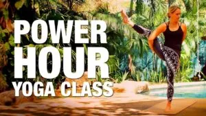 Class thumbnail: Power Hour Yoga Class, woman in a standing leg-lift pose by a pool