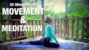 Class thumbnail: 30 Minute Movement and Meditation, woman in pigeon pose on a wooden deck