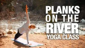 Class thumbnail: Planks on the River Yoga Class, woman in side plank on a riverbank
