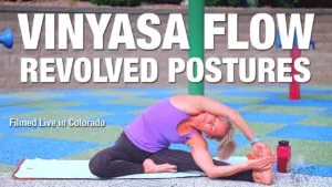 Class thumbnail: Vinyasa Flow Revolved Postures, woman in a seated twist, filmed live in Colorado