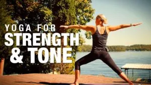 Class thumbnail: Yoga for Strength and Tone, woman in warrior two on a dock by a lake