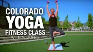 Class thumbnail: Colorado Yoga Fitness Class with weights, woman in tree pose on grass