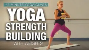 Class thumbnail: Yoga Strength Building with weights, 45 minute class, woman in a lunge holding dumbbells