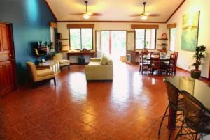 Casa Colorado living and dining area with tile floors and ceiling fans