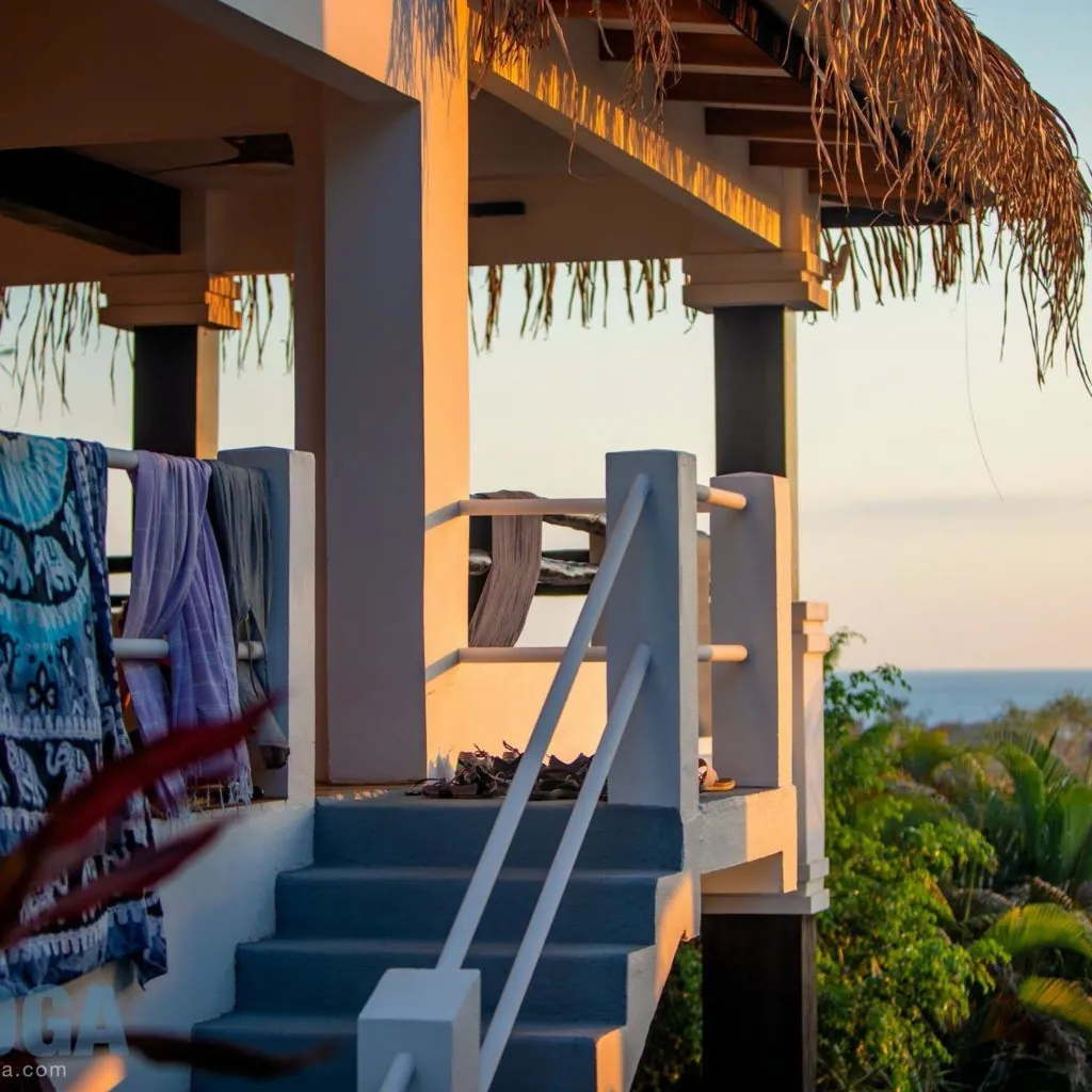 Covered porch with stairs and hanging beach towels