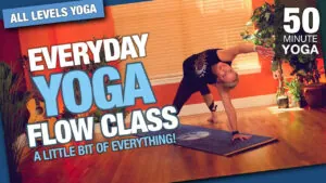 Everyday yoga flow class, 50 minutes, woman in a lunge twist on a wood floor