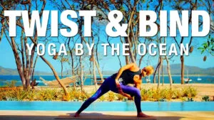 Twist and Bind yoga by the ocean, woman in a twisting lunge by a pool with ocean view